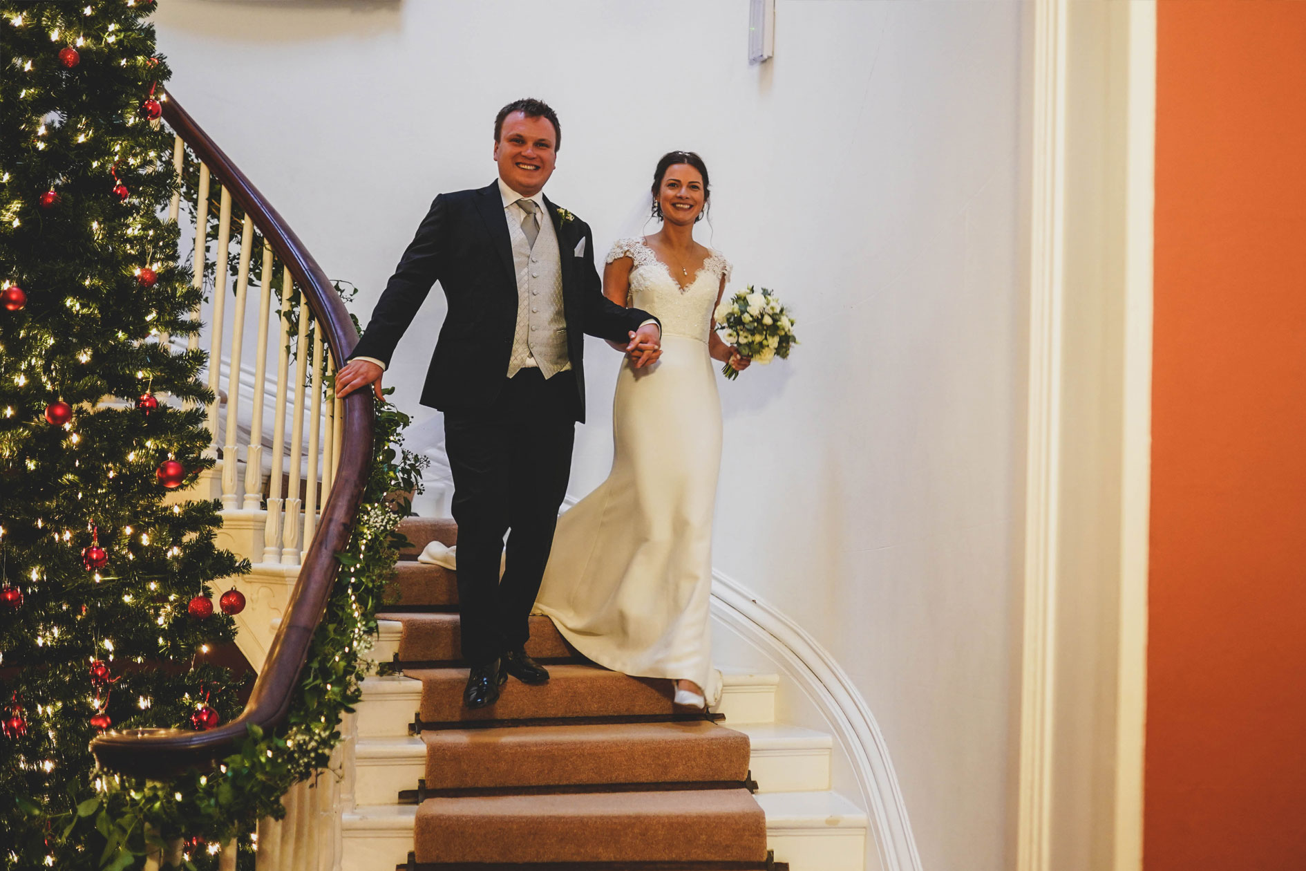 Bride and groom on spiral staircase